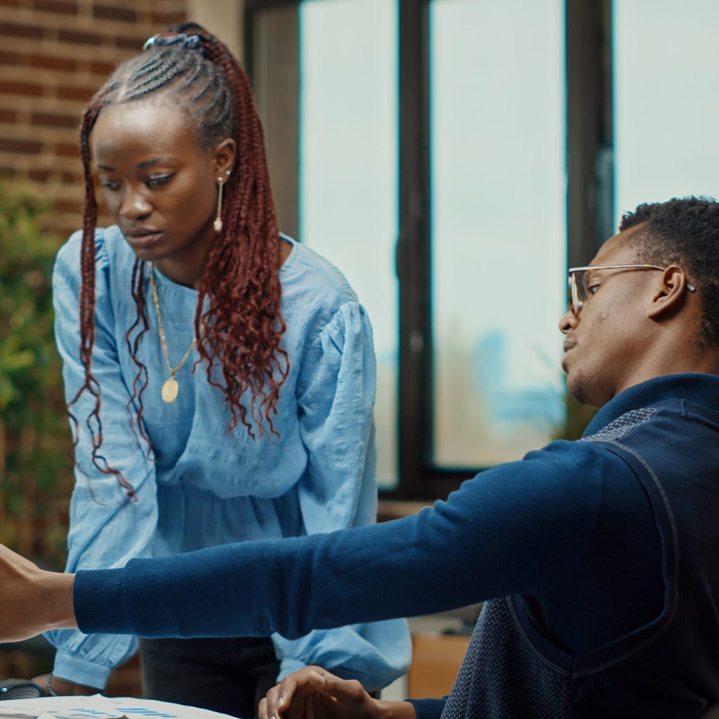 African american team discussing plans in coworking space, doing teamwork to create new business solution. Man and woman reading annual data statistics in corporate office, laptop presentation. SSUCv3H4sIAAAAAAAAA4VRy5LjIAz8F86mCoxtwP+wVXOY29QeeAiHCjEpg2c2m/K/r5w4M8flJLUaqVu6k+jJSASzvQXGqBy0p53gllrLWso7aZVSLIRhIA3xpgIZuRCiVV039FwKtr+GWFOiI+OdxJTWUhdTY57JiJUFZg/LIwQfa16iSZhtDSnV1LVAwW+YOew9YfWRv/p93HccBb6DO8055emGMspqEfoVi4OUzAx5LWRrXtQ3yNcE/6V9E8j2uyFmgtnddiXbLjmBeQj7ICBD61rPaSu0oV0PgRo3eGq09ty2YJS32EpZJ5w0knptNe28aqnVilHue91LoTkEhjRATIgQqBp6QbtgkaY0p2yQ0itmg1Qcaecp/5H+bwmaoLbzV4Xlcqwp19O+TXSR17kut6eTlPPVWHQ9BpMKNORkSkGCPwD8eF2ii/N0LBtvlC/PeM51t/pYSM3uHP0x6nmfU0R0n3Mn6zVl48Ef5dVeYq2vdIHPCF8/7G3b/gGQ7pXfXQIAAA==